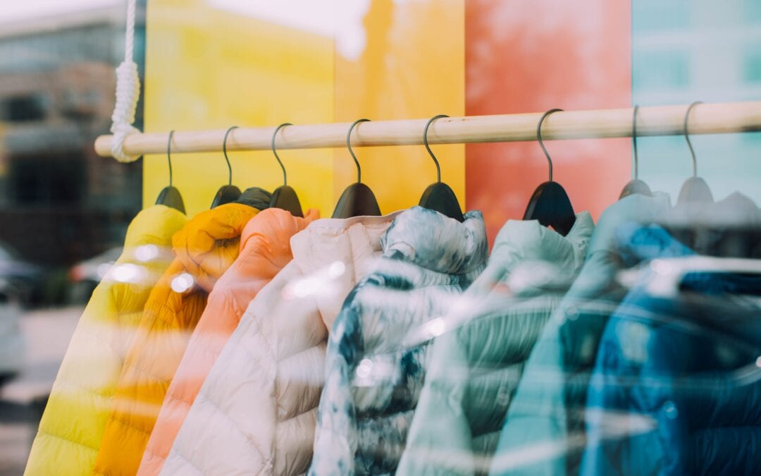 multi color jackets hanging on rack